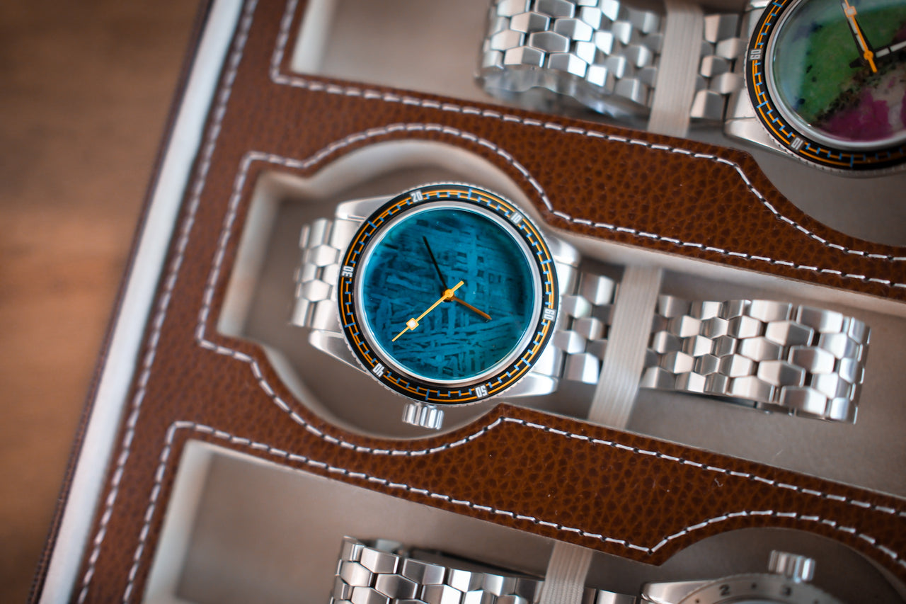 Teal meteorite dive-watch dial restored, in a leather watch case